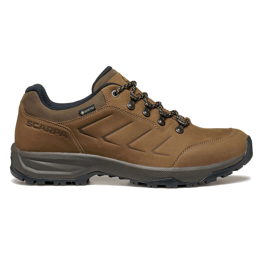 Scarpa Men’s Cyrus 2 GTX leather walking shoe in brown with a black sole, black lace eyelets, and patterned laces. This shoe boasts a rugged tread and subtle zigzag stitching along the side. A Gore-Tex label near the ankle underscores its status as a reliable waterproof hiking shoe.