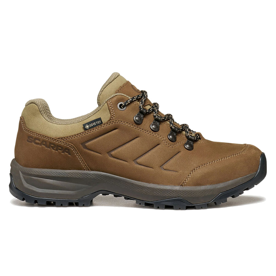 The Scarpa Women’s Cyrus 2 GTX is a brown, low-cut leather walking shoe featuring black and brown laces, a rugged black sole, and SCARPA branding on the side. Shown in side profile on a white background, this waterproof GORE-TEX hiking shoe offers reliable weather protection and durability for outdoor adventures.