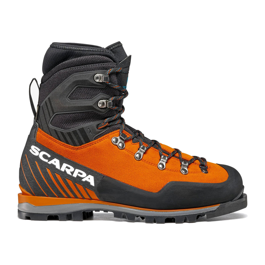 A single orange and black Men’s Mont Blanc Pro GTX technical mountaineering boot with rugged tread, metal eyelets, and the Scarpa brand name in white on the side, shown in profile facing right.