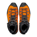 A pair of Scarpa Men’s Mont Blanc Pro GTX technical mountaineering boots in orange and black, viewed from above, featuring black laces threaded through metal eyelets and textured toe caps. These boots have high ankles and a rugged construction designed for demanding outdoor use.