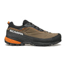 Introducing the Scarpa Men’s Rapid XT GORE-TEX approach shoe in brown and black with striking orange accents, a rugged sole, and black laces. This side-profile view against a white background highlights its advanced GORE-TEX ePE technology for reliable waterproof protection on hiking adventures.