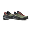 A pair of Scarpa Women’s Rapid XT GORE-TEX approach shoes in green and black with red laces and accents, featuring rugged Vibram Megagrip soles, GORE-TEX ePE technology, and branded detailing on the side, displayed on a white background.