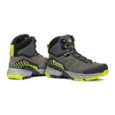 A pair of Scarpa Men’s Rush TRK GORE-TEX hiking boots in gray and black with yellow accents and laces, featuring rugged soles and side branding, displayed on a white background.