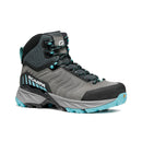 Introducing the Scarpa Women’s Rush TRK GORE-TEX hiking boot, featuring a stylish gray and black design with teal accents and teal laces. The Scarpa logo appears on the side. This GORE-TEX boot delivers dependable waterproof protection and is equipped with a rugged sole, making it ideal for all your outdoor adventures.