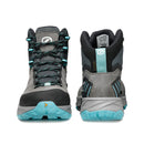 The Scarpa Women’s Rush TRK GORE-TEX hiking boots are pictured from the front and back against a white background. This grey and black pair features turquoise laces and soles, offering reliable waterproof protection for outdoor adventures with their GORE-TEX construction.