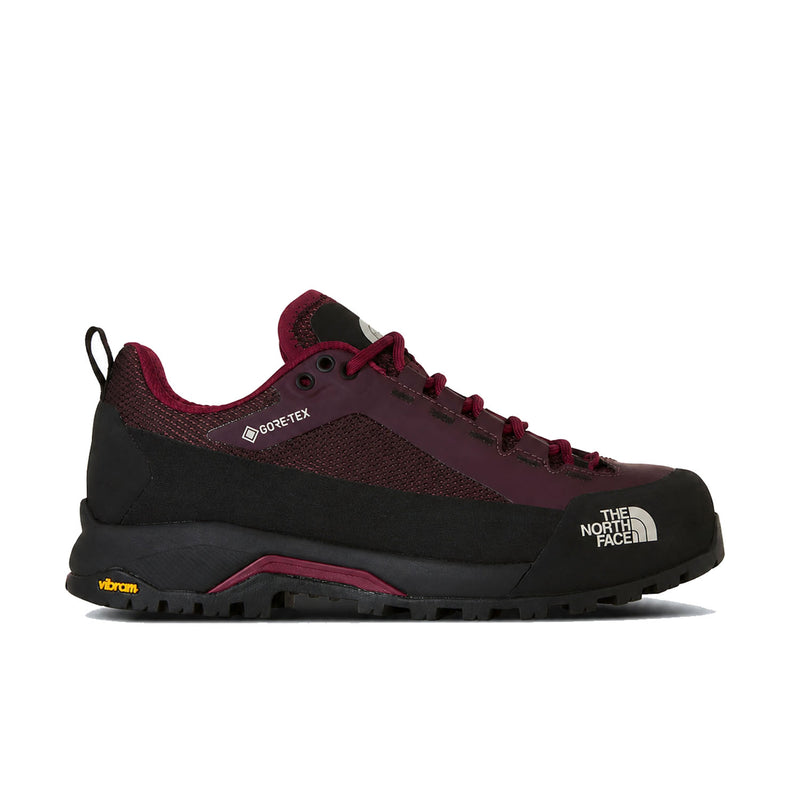 A single The North Face hiking shoe in black and burgundy, featuring a breathable mesh upper, lace-up closure, and rugged Vibram sole, shown against a plain white background.