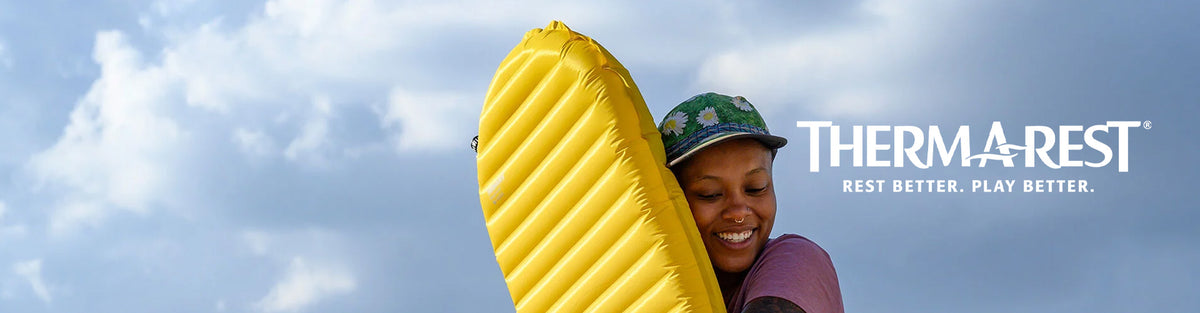 Lady holding her Therm-a-rest Xtherm sleeping pad.