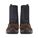 A pair of brown hiking boots fitted with Trekmates Glenmore GORE-TEX Ankle Gaiters, shown from the front against a white background, provides superior trail protection for your next adventure.
