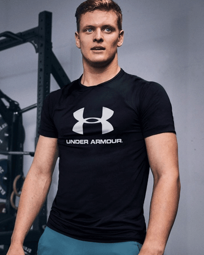 Man wearing under armour tshirt in gym