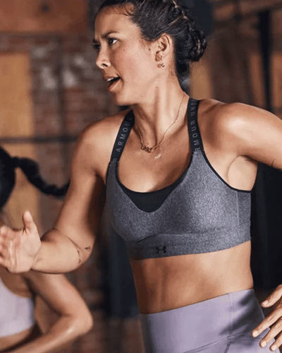 woman running on threadmill in gym