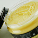 Jar of Grangers waterproof wax cream with a black lid on a white background